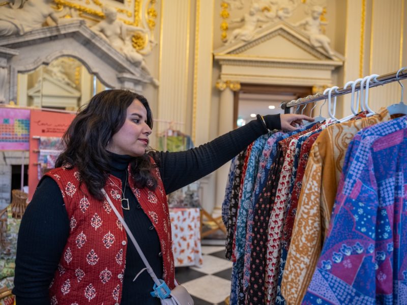 A woman looking at clothes