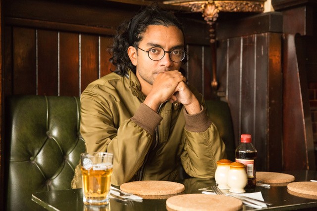 Man sitting in pub with a beer